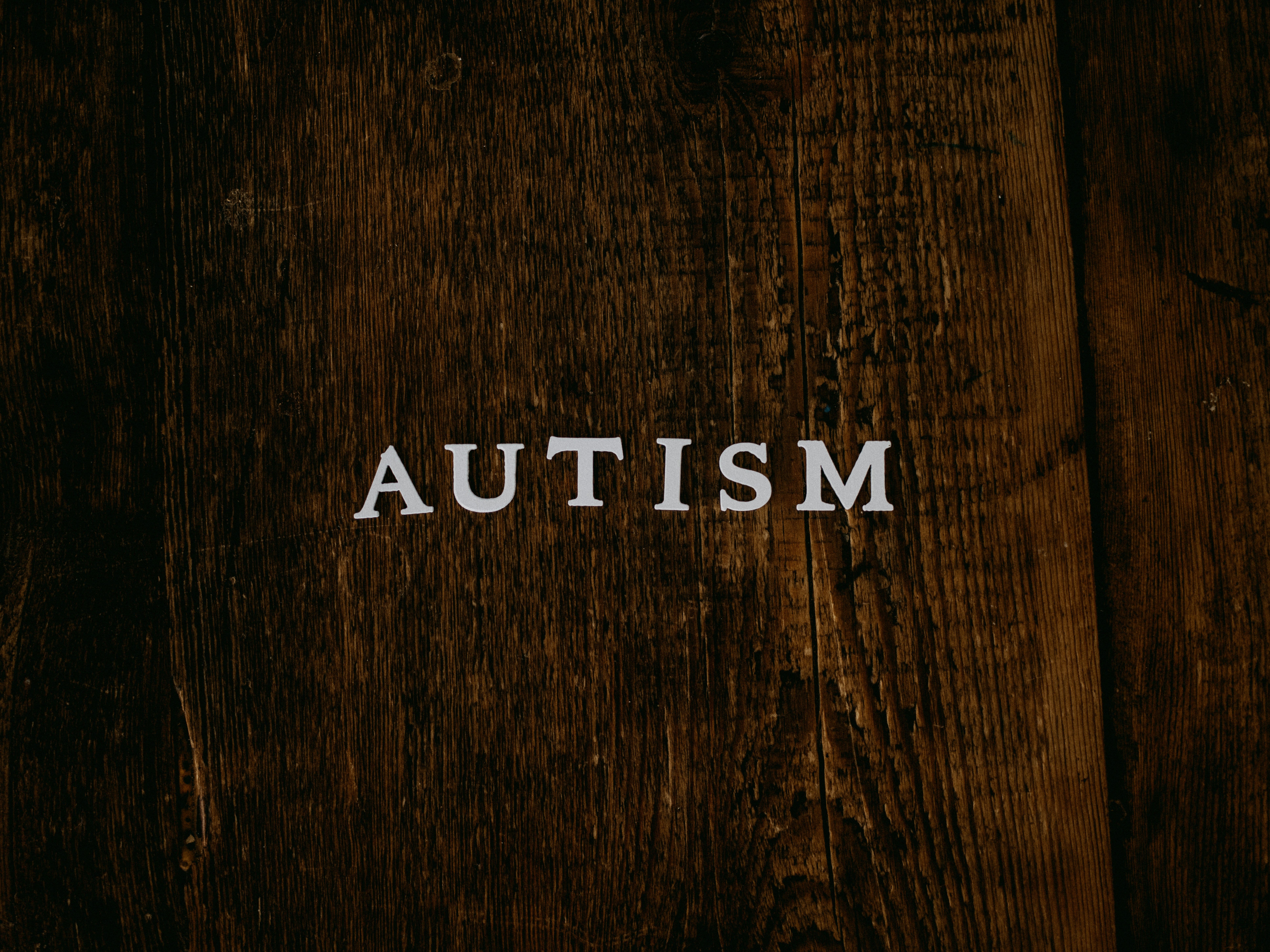 Simple block letters forming the word ‘AUTISM’, representing awareness and visibility.