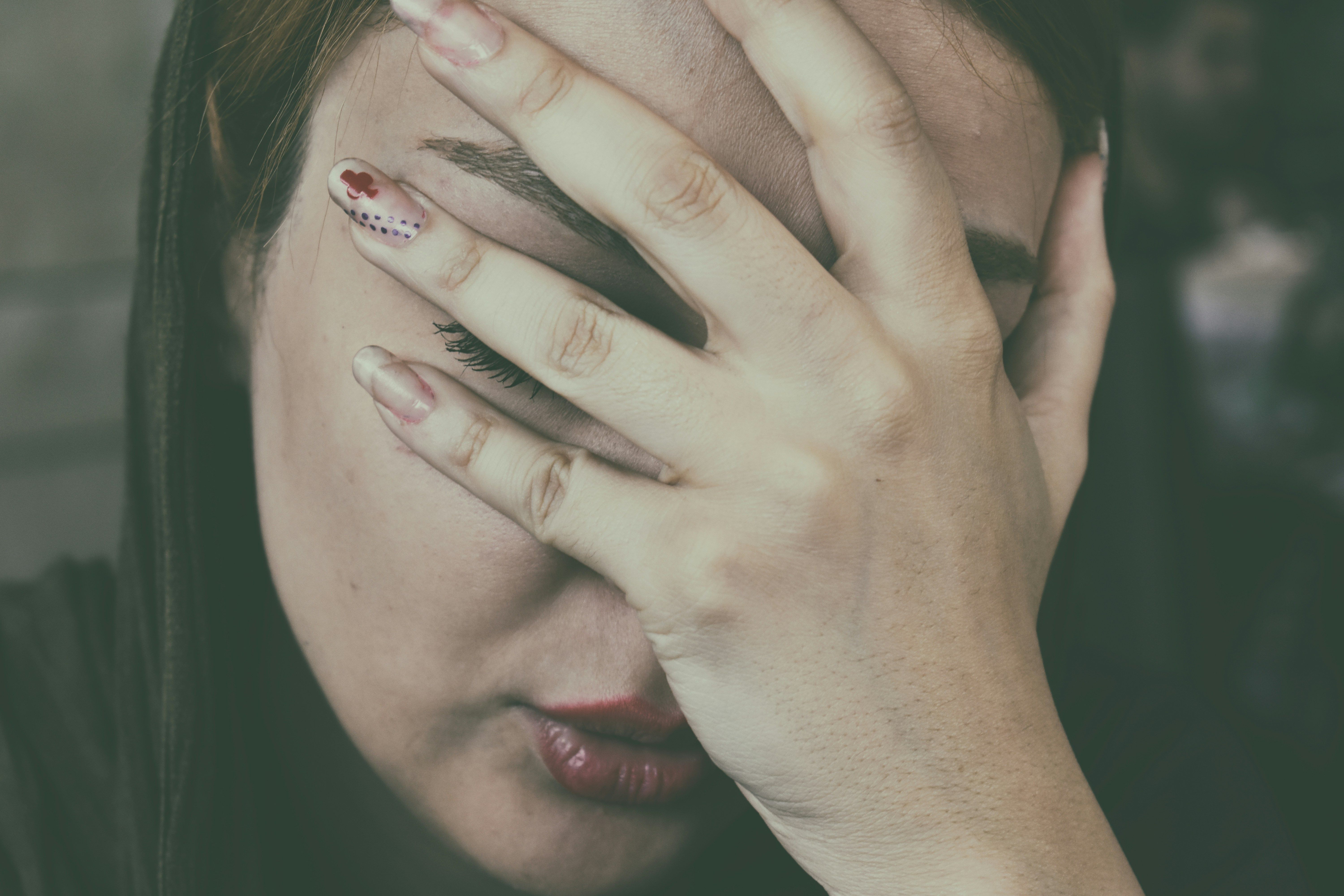 A woman looking thoughtful and withdrawn